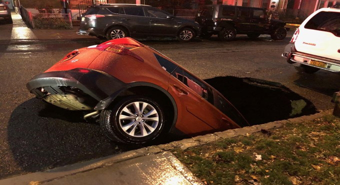 Sinkhole in NYC swallows SUV